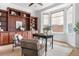 Stylish office space with hardwood floors, decorative shelving, and an abundance of natural light at 27485 E Nova Pl, Aurora, CO 80016
