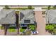 Home with solar panels, paved driveway, backyard with artificial turf, and upper-level patio at 10560 Waco St, Commerce City, CO 80022