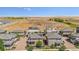 Well-planned community with modern homes, solar panels, and spacious lots under a bright blue sky at 10560 Waco St, Commerce City, CO 80022