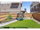 Backyard featuring artificial turf and fenced perimeter at 10560 Waco St, Commerce City, CO 80022