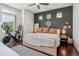 Comfortable bedroom with modern decor, dark accent wall and a large window at 10560 Waco St, Commerce City, CO 80022