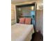 Bedroom featuring Murphy bed and a decorative screen at 10560 Waco St, Commerce City, CO 80022