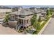 Beautifully landscaped home featuring a welcoming front porch, manicured garden, and attached garage at 10560 Waco St, Commerce City, CO 80022