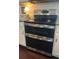 Stainless steel oven with glass cooktop and double oven in updated kitchen at 10560 Waco St, Commerce City, CO 80022