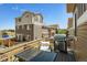 Spacious patio features a grill, outdoor seating, and views of surrounding homes at 10560 Waco St, Commerce City, CO 80022