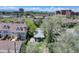 Overhead view of a charming house surrounded by lush greenery, highlighting its peaceful setting at 150 S Garfield St, Denver, CO 80209