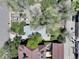 Aerial view capturing the layout of the property, including the house, driveway, backyard patio, and surrounding greenery at 150 S Garfield St, Denver, CO 80209