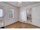 Bedroom featuring hardwood floors, natural light, and easy access to ensuite bath at 150 S Garfield St, Denver, CO 80209