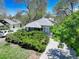Traditional home with lush, mature landscaping and a private driveway at 150 S Garfield St, Denver, CO 80209