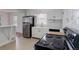 Bright, remodeled kitchen featuring stainless steel appliances and white cabinets at 150 S Garfield St, Denver, CO 80209
