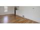 Open-concept living area with hardwood floors, stainless appliances, and bright, modern design at 150 S Garfield St, Denver, CO 80209
