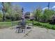 Outdoor patio with an umbrella-covered table and seating offers a relaxing space for outdoor dining and gatherings at 150 S Garfield St, Denver, CO 80209