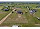 Aerial view of property featuring a home with outbuildings, all in a rural setting at 1740 Territory Cir, Parker, CO 80138
