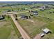 Areal view of a large property featuring a single-Gathering home, detached building, and extensive pasture at 1740 Territory Cir, Parker, CO 80138