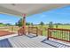 An outdoor deck featuring wood flooring and railings, showcasing an expansive backyard view at 1740 Territory Cir, Parker, CO 80138