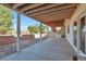 Covered back patio with concrete flooring and stairs leading to the backyard at 1740 Territory Cir, Parker, CO 80138