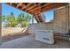 Covered back patio featuring a generator, stairs to the backyard, and natural lighting at 1740 Territory Cir, Parker, CO 80138