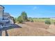 Spacious backyard with a patio area, offering ample room for outdoor activities and relaxation at 1740 Territory Cir, Parker, CO 80138