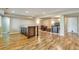 Finished basement with wood flooring, bar, and cozy seating area at 1740 Territory Cir, Parker, CO 80138