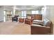 Basement rec room with multiple leather chairs and bar area for entertaining at 1740 Territory Cir, Parker, CO 80138