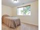 Bedroom featuring carpeted floors, a window bringing in natural light, and tan colored walls at 1740 Territory Cir, Parker, CO 80138