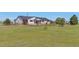 Exterior view of a single-story home with a spacious front yard and wooden fencing at 1740 Territory Cir, Parker, CO 80138