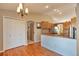 Eat-in kitchen featuring light wood cabinetry, granite countertops, and stainless steel appliances at 1740 Territory Cir, Parker, CO 80138
