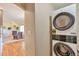 Laundry area with a stacked washer and dryer unit, conveniently located near the living space at 1740 Territory Cir, Parker, CO 80138