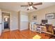 Office space with hardwood floors, with view into the bathroom, as well as, a white board at 1740 Territory Cir, Parker, CO 80138