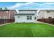 The backyard features a well-maintained artificial lawn perfect for outdoor activities and relaxation at 7868 Downing St, Denver, CO 80229