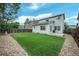 Spacious backyard featuring an artificial grass lawn, perfect for low-maintenance outdoor enjoyment at 7868 Downing St, Denver, CO 80229