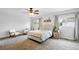 Bright bedroom with neutral tones, a ceiling fan, and large windows for plenty of natural light at 7868 Downing St, Denver, CO 80229