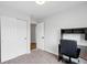 Bedroom with carpet, a desk, and a closet for storage at 7868 Downing St, Denver, CO 80229