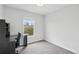 Bedroom with carpet, a desk, and a window offering natural light for a workspace at 7868 Downing St, Denver, CO 80229