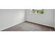Bedroom featuring neutral carpet and paint, a window, and simple, clean design at 7868 Downing St, Denver, CO 80229