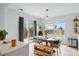 Bright dining area with sliding doors, bench seating, and a view of the backyard at 7868 Downing St, Denver, CO 80229