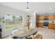 Charming dining room open to the kitchen with stainless steel appliances and plenty of natural light at 7868 Downing St, Denver, CO 80229