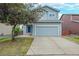 Charming two-story home featuring a well-maintained front yard and a two-car garage at 7868 Downing St, Denver, CO 80229