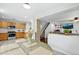 Open-concept kitchen connected to the living room and dining area, featuring modern appliances at 7868 Downing St, Denver, CO 80229