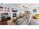 Cozy living room with a fireplace, flat screen tv, modern furniture and bright, neutral colors at 7868 Downing St, Denver, CO 80229