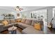 Comfortable living room with a ceiling fan, stylish decor and a large sectional sofa at 7868 Downing St, Denver, CO 80229