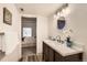 Stylish bathroom featuring a modern vanity and a doorway to a bedroom at 9700 E Iliff Ave # C20, Denver, CO 80231