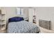 Inviting bedroom, carpeted, with a cozy layout and easy access to the bathroom at 1011 Uvalda St, Aurora, CO 80011