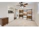 Open-concept living room with hardwood-style flooring with a kitchen view at 1011 Uvalda St, Aurora, CO 80011