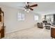 Spacious living room featuring neutral colors, a ceiling fan, and natural light at 1011 Uvalda St, Aurora, CO 80011