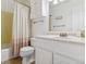 Bathroom with a vanity, a toilet, and a shower with a curtain at 12520 W Virginia Ave, Lakewood, CO 80228