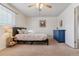 Serene bedroom with a comfortable bed, soft carpet, and ample natural light at 12520 W Virginia Ave, Lakewood, CO 80228