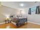 Cozy bedroom features a wood floor, a window, and a cute blue bed frame at 12520 W Virginia Ave, Lakewood, CO 80228