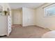 Large bedroom with plush carpet, closet space, and neutral paint at 12520 W Virginia Ave, Lakewood, CO 80228