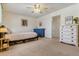 Spacious bedroom featuring neutral colors, plush carpeting, and two dressers at 12520 W Virginia Ave, Lakewood, CO 80228